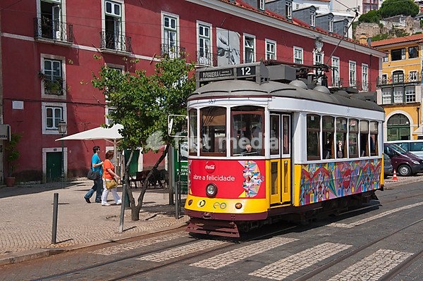 Tram in a street in Alfama district, Lisbon, Portugal, Europe