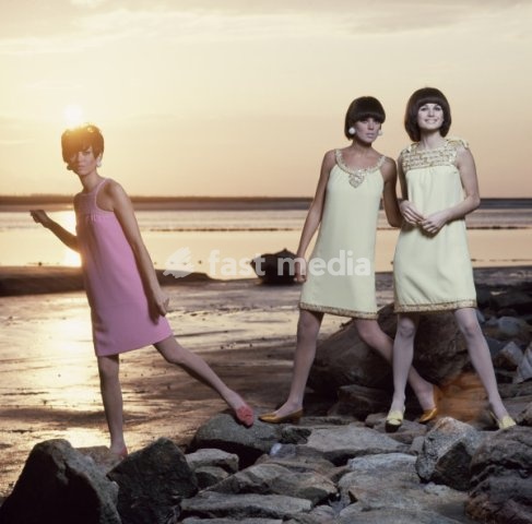 Fashion: Women's fashion / 1960s. Three models on the coast of Britanny at sunset. Photo, France, 1960s
