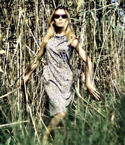 Fashion: Women's fashion. France. Model posing between reeds. Photo, 1960s