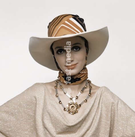 Fashion: Women's fashion, France / Photo, 1960s. Model with hat and scarf. Photo, Paris, undated