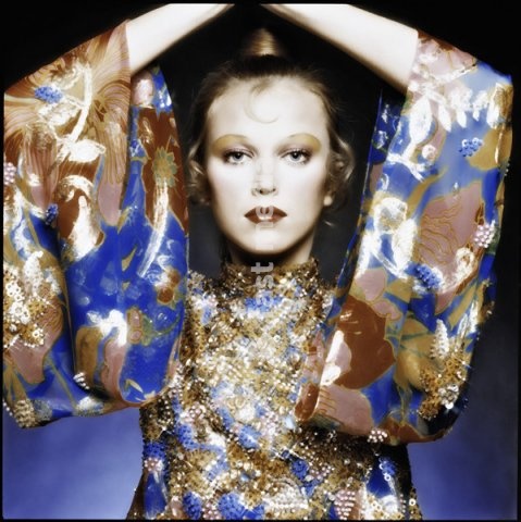 Fashion: Women's fashion, France / Photo, 1960s. Model wearing a wide-sleeved print dress with sequins. Photo, Paris, undated