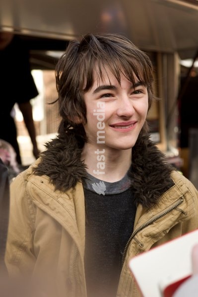 Isaac Hempstead Wright who plays Bran Stark in the series Game of Thrones by the Game of Thrones Westeros Food Wagon to celebrate the release of Season Two on DVD and Blu-ray, Tottenham Court Road.,London