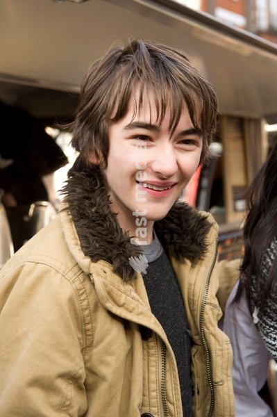 Isaac Hempstead Wright who plays Bran Stark in the series Game of Thrones by the Game of Thrones Westeros Food Wagon to celebrate the release of Season Two on DVD and Blu-ray, Tottenham Court Road.,London