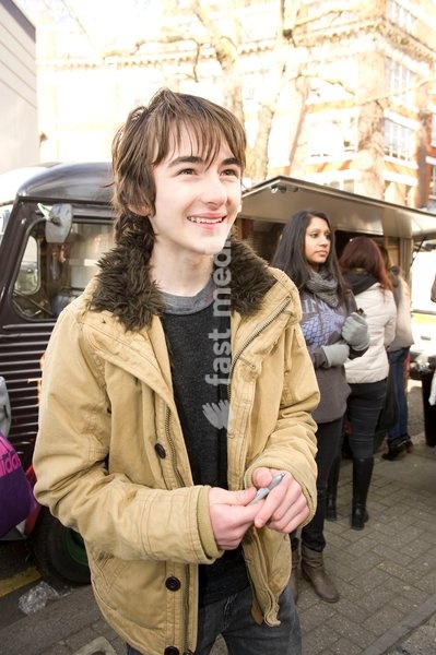Isaac Hempstead Wright who plays Bran Stark in the series Game of Thrones by the Game of Thrones Westeros Food Wagon to celebrate the release of Season Two on DVD and Blu-ray, Tottenham Court Road.,London