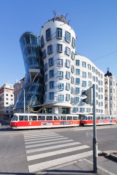 Tram in front of the Dancing House (Ginger and Fred) by Frank Gehry, Prague, Bohemia, Czech Republic, Europe