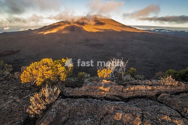 Sunset with clouds over the crater of the Piton de la Fournaise volcano, Reunion