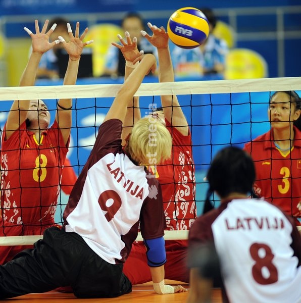 (080907) -- BEIJING, Sept. 7, 2008 -- Oksana Gromova(#9) of Latvia attacks during the women's sitting volleyball preliminary match between Latvia and China of the Beijing 2008 Paralympic Games in Beijing, China, Sept. 7, 2008. China won the match 3-0. (Yang Zongyou)(wx)