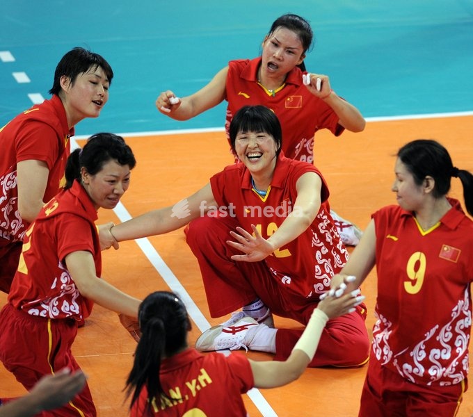 (080909) -- BEIJING, Sept. 9, 2008 -- Members of Chinese team celebrate for scoring after the women's sitting volleyball preliminary match between China and the United States of the Beijing 2008 Paralympic Games in Beijing, China, Sept. 9, 2008. China won the match 3-0. ( Yang Zongyou)(wx)
