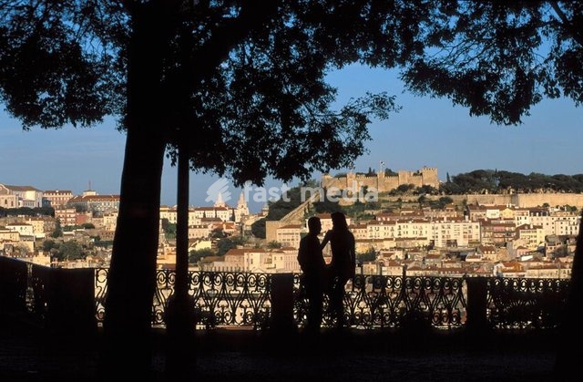Lisbon, romantic couple and view on the castle of Sao Jorge
