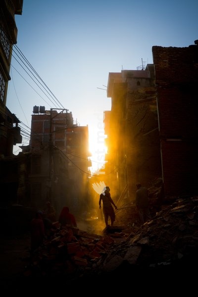 Rays of early evening sun on the dusty streets of Thamel after earthquake, Kathmandu, Nepal, Asia