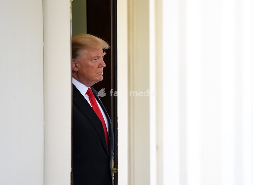 (170531) -- WASHINGTON, May 31, 2017 () -- U.S. President Donald Trump awaits the arrival of Vietnamese Prime Minister Nguyen Xuan Phuc at the White House in Washington D.C., the United States, on May 31, 2017. U.S. President Donald Trump said Wednesday that the world would know his decision on the…