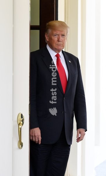 (170531) -- WASHINGTON, May 31, 2017 () -- U.S. President Donald Trump awaits the arrival of Vietnamese Prime Minister Nguyen Xuan Phuc at the White House in Washington D.C., the United States, on May 31, 2017. U.S. President Donald Trump said Wednesday that the world would know his decision on the…