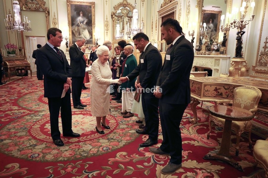 Queen Elizabeth II meets rugby players Mako (2nd right) and Billy Vunipola at a reception to celebrate the Commonwealth Diaspora community, in the lead up to the Commonwealth Heads of Government meeting in London this April, at Buckingham Palace, London