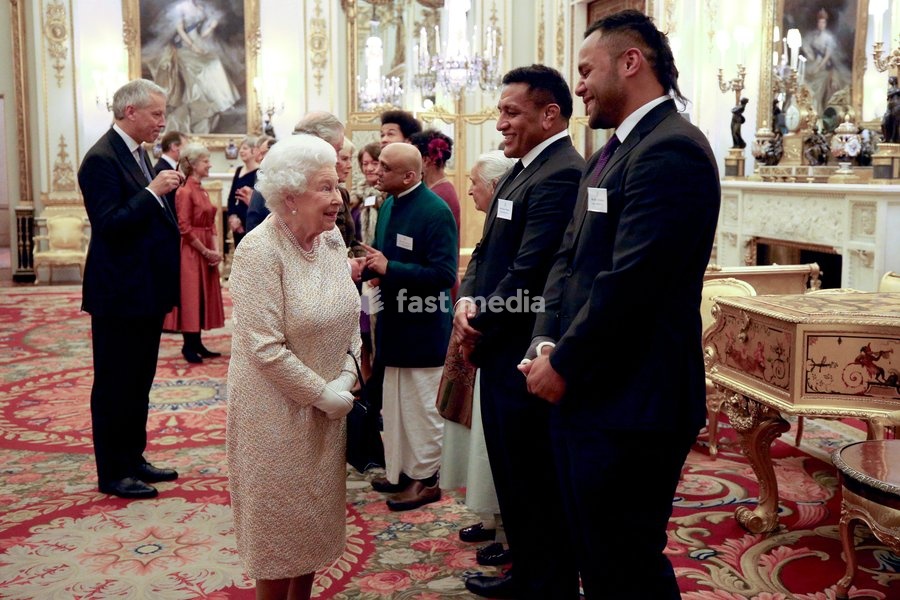 Queen Elizabeth II meets rugby players Mako (2nd right) and Billy Vunipola at a reception to celebrate the Commonwealth Diaspora community, in the lead up to the Commonwealth Heads of Government meeting in London this April, at Buckingham Palace, London