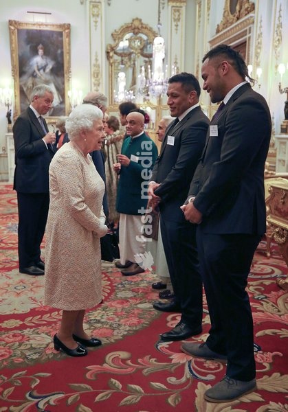 Queen Elizabeth II meets rugby players Mako (2nd right) and Billy Vunipola at a reception to celebrate the Commonwealth Diaspora community, in the lead up to the Commonwealth Heads of Government meeting in London this April, at Buckingham Palace, London