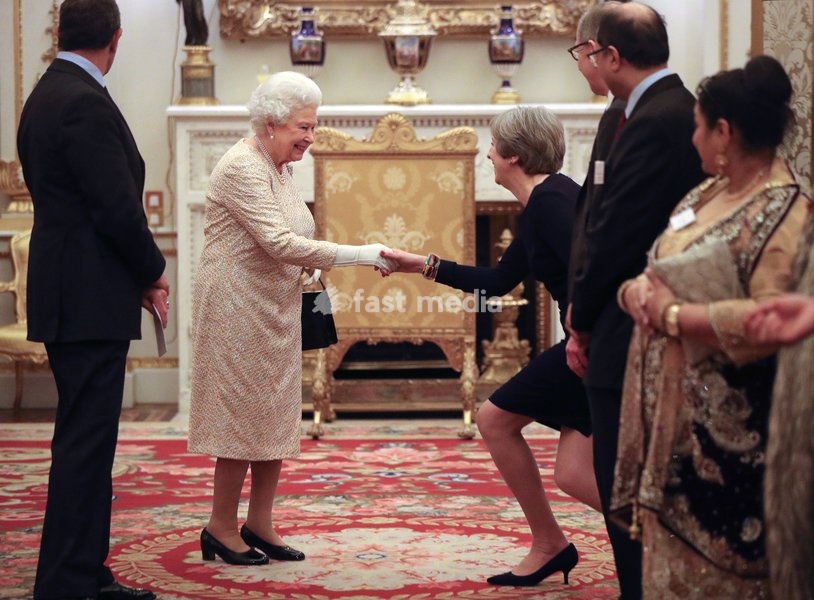 Queen Elizabeth II greets Prime Minister Theresa May at a reception to celebrate the Commonwealth Diaspora community, in the lead up to the Commonwealth Heads of Government meeting in London this April, at Buckingham Palace, London