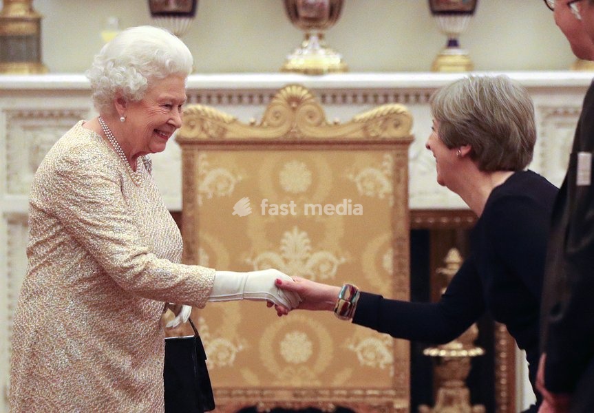 Queen Elizabeth II greets Prime Minister Theresa May at a reception to celebrate the Commonwealth Diaspora community, in the lead up to the Commonwealth Heads of Government meeting in London this April, at Buckingham Palace, London