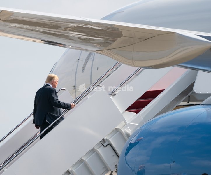 United States President Donald J. Trump boards Air Force One at Joint Base Andrews, Maryland, en route to events in Illinois, Missouri and Iowa, July 26, 2018