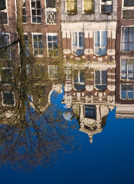 Houses reflecting in the water, Singel Canal, Amsterdam, Netherlands, Europe