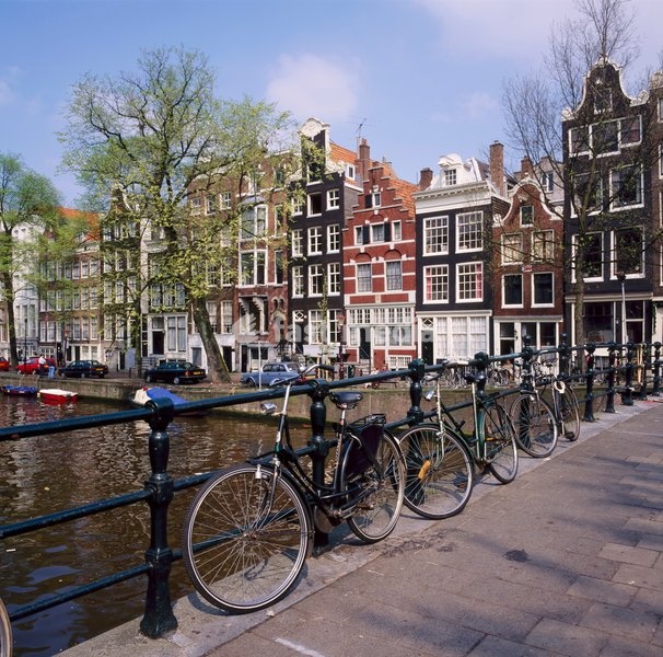 Bicycles on a bridge across the canal at Herengracht in Amsterdam, Holland