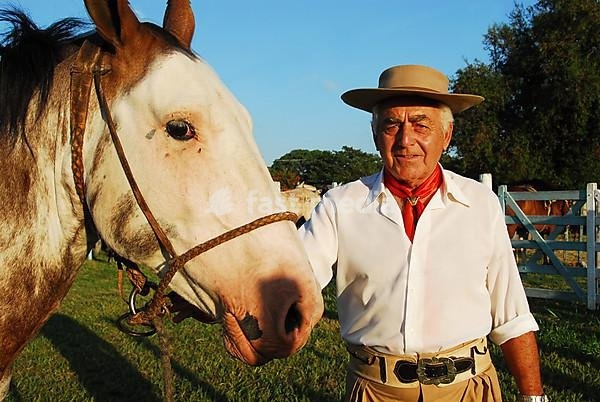 Gaucho with typical hat, scarf and horse, Diamante, Entre Rios province, Argentina
