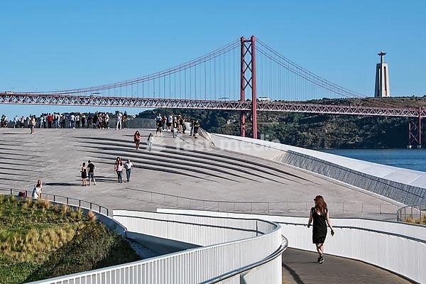 View from the pedestrian bridge to the roof of the museum MAAT, Museu de Arte, Arquitetura e Tecnologia, at the Rio Tejo, behind bridge Ponte 25 de Abril, Belem, Lisbon, Portugal