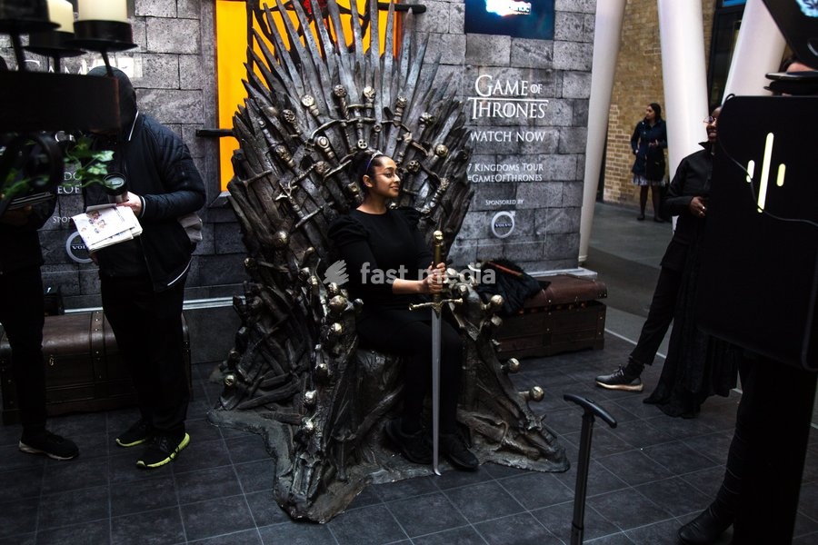 Fans sit on the Iron Throne to pose for Sky Atlantic's Release of the Final Season of Game of Thrones at Kings Cross St Pancras on the 15th April 2019 - (0)