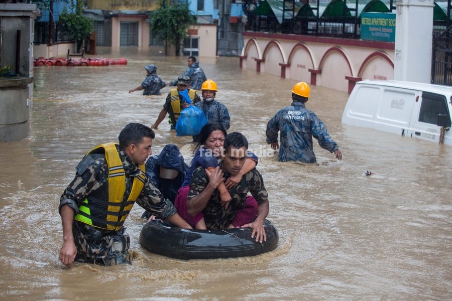 (190712) -- KATHMANDU, July 12, 2019 () -- Nepalese army personnel rescue local people after a heavy rainfall in Kathmandu, Nepal, July 12, 2019. Nepal was hit by heavy rainfall that caused floods and landslides in many places