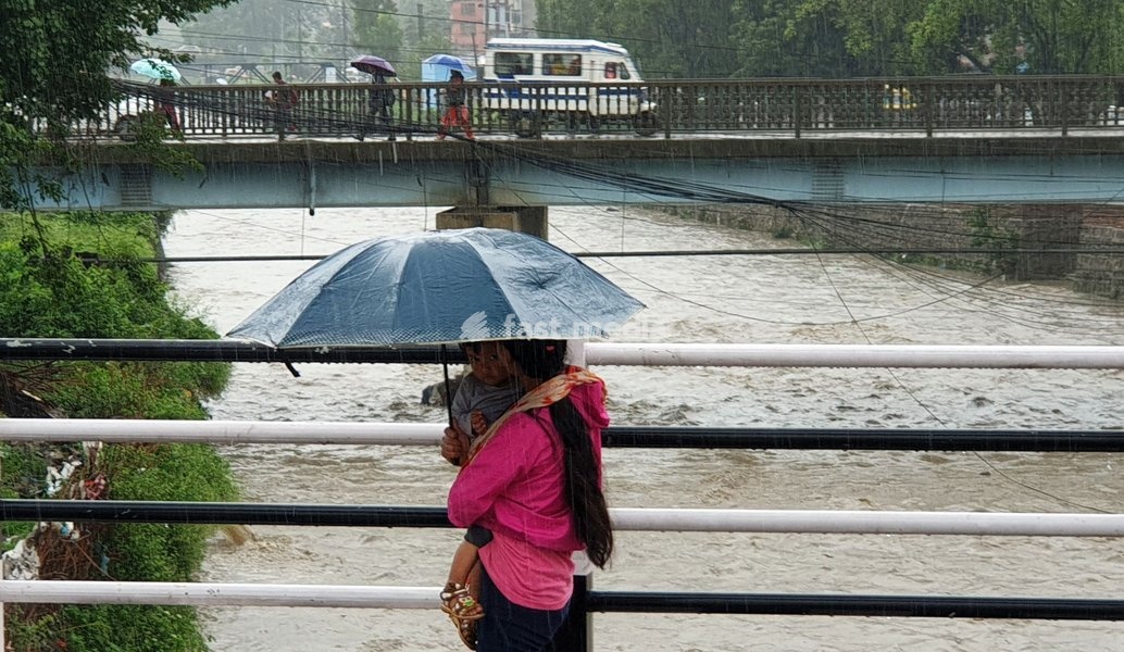 (190712) -- KATHMANDU, July 12, 2019 () -- Pedestrians walk on bridges over the swollen Bagmati River after heavy rainfall in Kathmandu, Nepal, July 12, 2019. Heavy rains leave Nepalese people at risks of floods and landslides during Monsoon season. Meteorological Forecasting Division under…