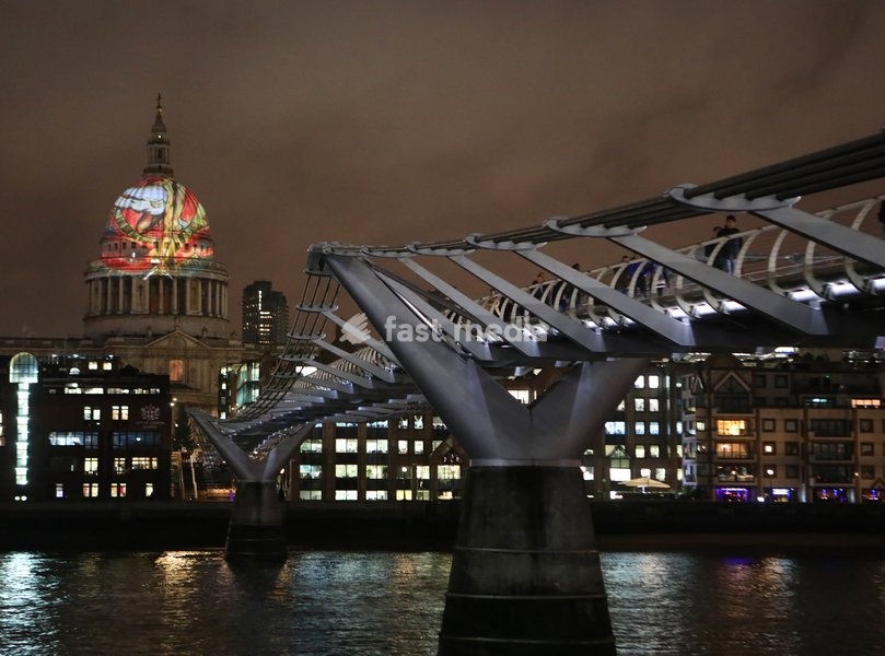 The iconic dome of St Paul's Cathedral is illuminated with William Blake's final masterpiece 'Ancient of Days ,to celebrate the artist's birthday. 27 Nov 2019