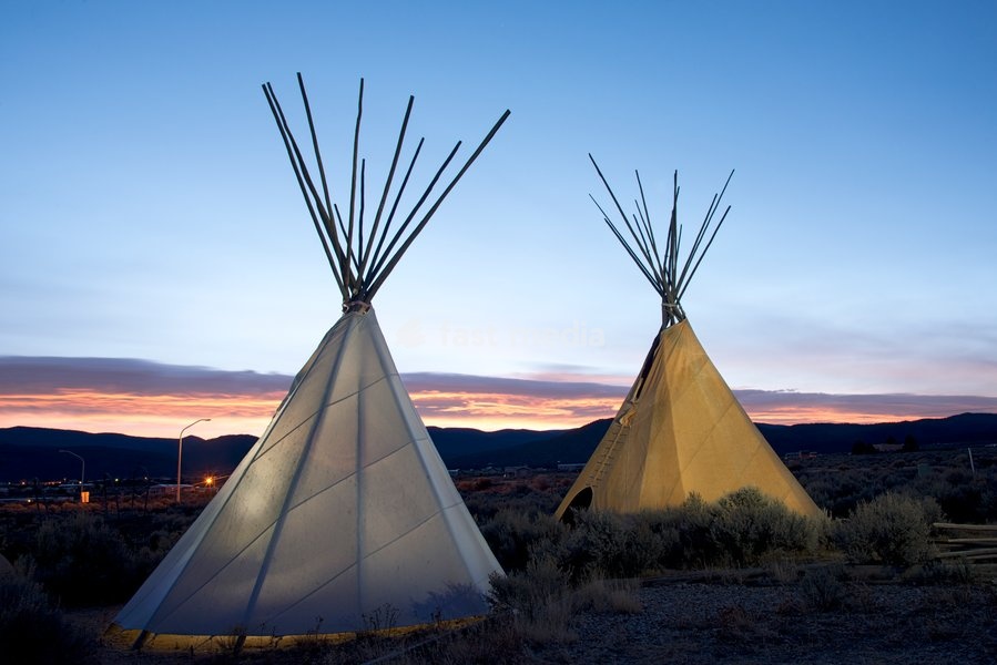Teepees (tipis) on display at sunset in Taos, New Mexico, United States of America, North America