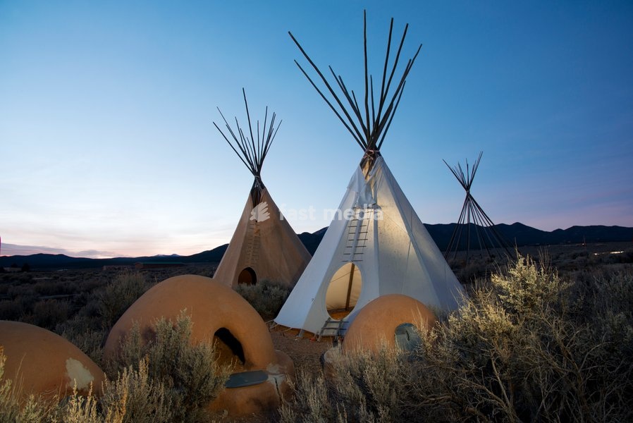 Teepees (tipis) on display at dusk in Taos, New Mexico, United States of America, North America