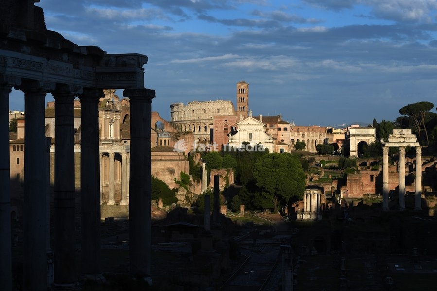 The Roman Forum (Italian: Foro Romano) seen from Capitol Hill. The Forum is a rectangular forum surrounded by the ruins of several important ancient government buildings at the center of the city of Rome. Left: Temple of Saturn Background : The church Santa Francesca Romana and the Colosseum Right:…