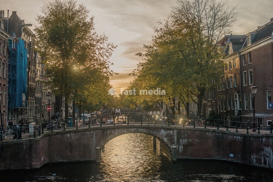 The sun sets on a canal in Amsterdam, The Netherlands