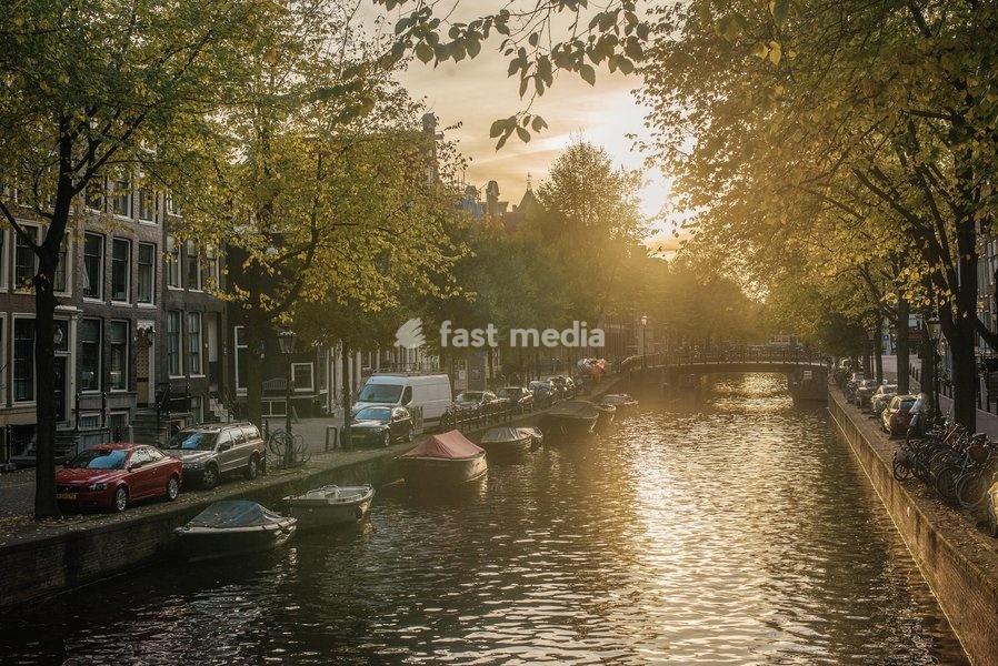 The sun sets on a canal in Amsterdam, The Netherlands