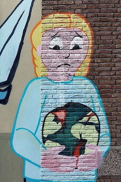 Graffito, child with sad face holds globe, earth in flames, environmental destruction, climate protection, Düsseldorf, North Rhine-Westphalia, Germany