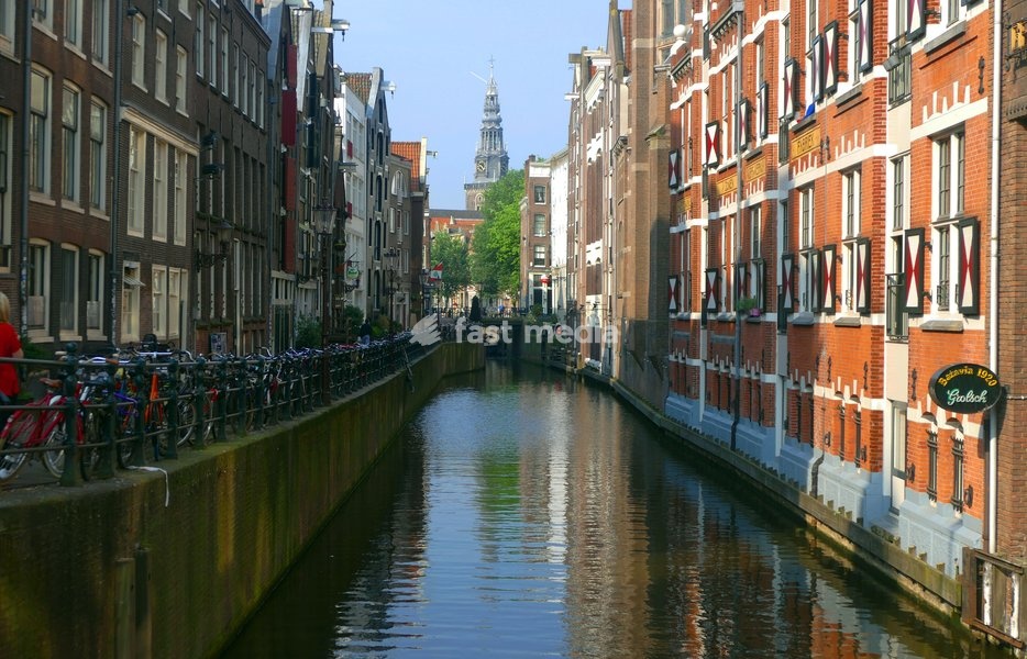Canals in Amsterdam, Netherlands are used to transport people, tourists and supplies