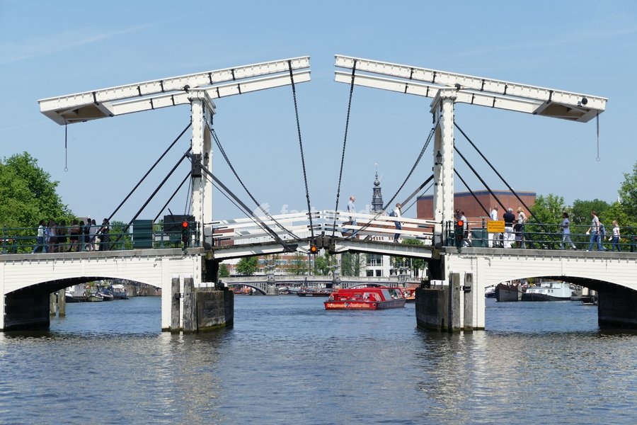 Canals in Amsterdam, Netherlands are used to transport people, tourists and supplies