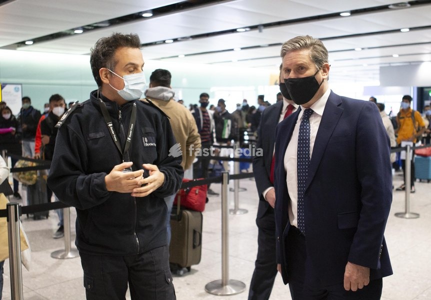 Keir Starmer MP leader of the Labour Party visits Londons Heathrow Airport Terminal 2 today . To see the Airports COVID response accompanied by Nick Thomas-Symonds Shadow Home Secretary (red tie )