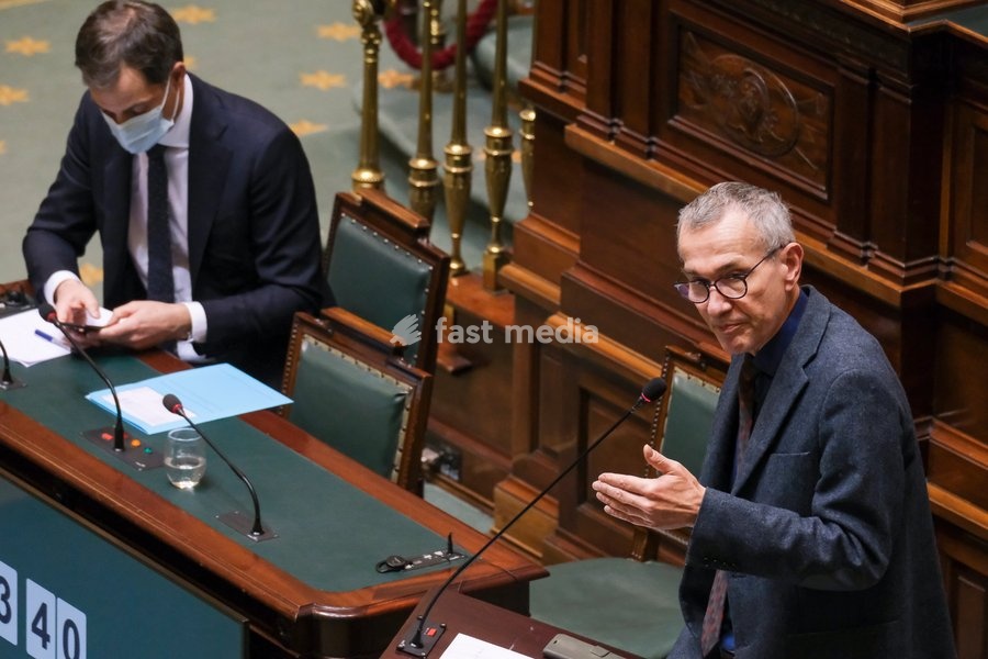 Prime Minister Alexander De Croo and Vice-prime minister and Public Health and Social Affairs minister Frank Vandenbroucke pictured during a plenary session of the chamber at the federal parliament in Brussels, Thursday 04 March 2021