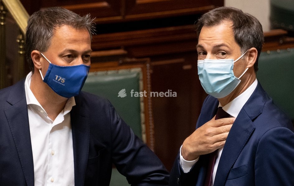 Open Vld's Egbert Lachaert and Prime Minister Alexander De Croo pictured during a plenary session of the chamber at the federal parliament in Brussels, Thursday 08 July 2021
