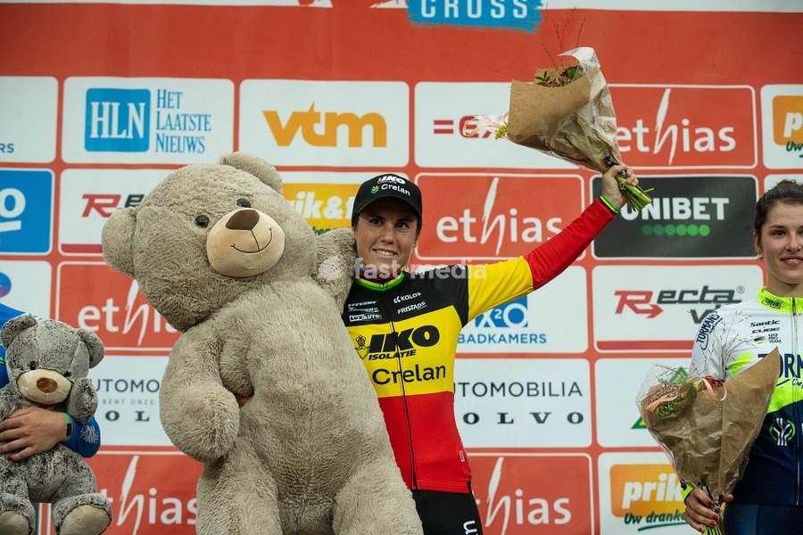 Belgian Sanne Cant and Dutch Marie Schreiber celebrate on the podium after the women's elite race of the 'Berencross Meulebeke' cyclocross cycling even, the fourth race (out of 8) in the 'Ethias Cross' competition, Saturday 02 October 2021 in Meulebeke