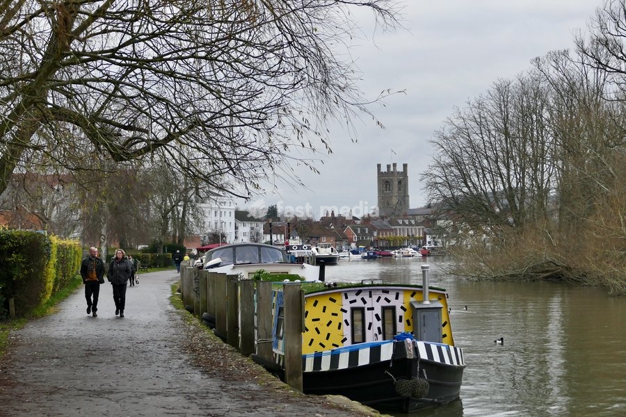 Walkers along The Thames Path on a mild, overcast afternoon