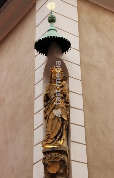 Poland, city of Poznan (former German: Posen): statue of Woman of the Apocalypse at street corner in Old Town