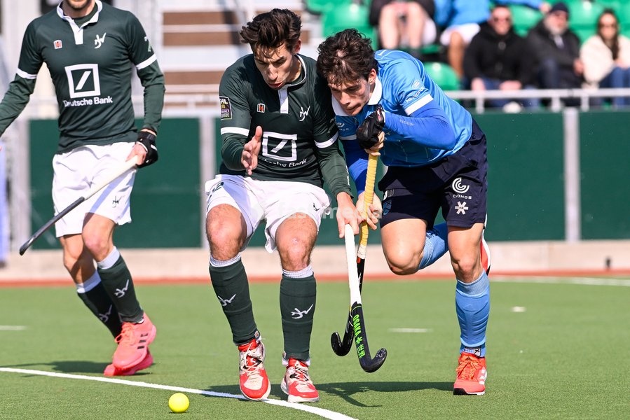 Watducks' Emile Esquelin and Braxgata's Tobias Biekens fight for the ball during a hockey game between Waterloo Ducks HC and Braxgata, Sunday 06 March 2022 in Waterloo, on the 14th day of the men's Belgian League season 2021-2022
