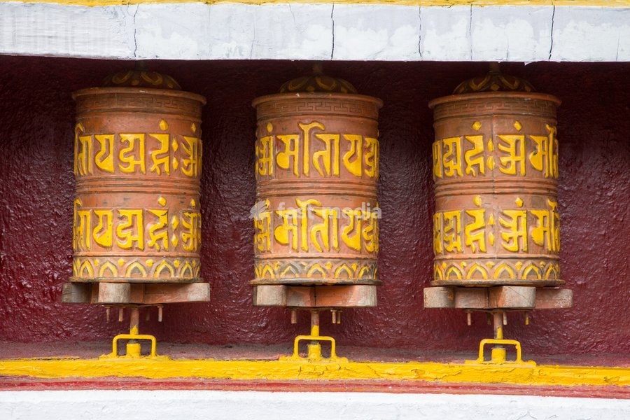 Tibetan-style prayer wheels at a shrine in the Tashi Ling Tebetan Refugee Settlement in Pokhara, Nepal