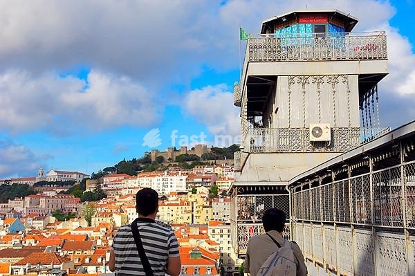 Lisbon, Tourist at Santa Justa elevator and St George's Castle at background, Elevador de Santa Justa, Castelo de Sao Jorge, Portugal