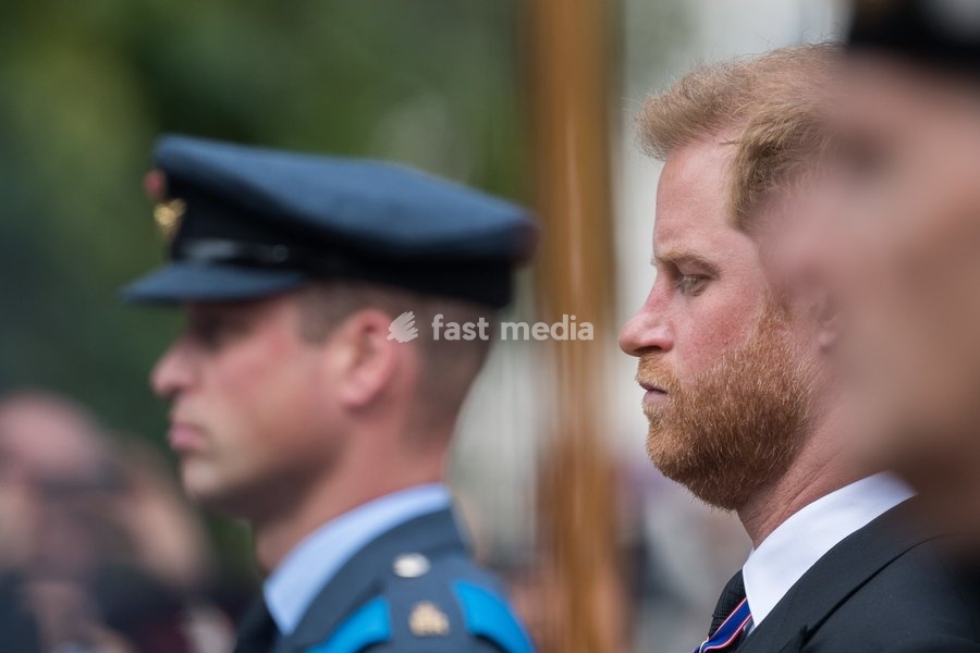 Harry, Duke of Sussex and William Prince of Wales walk behind the coffin during The State Funeral of Queen Elizabeth II on The Mall, 19th September 2022