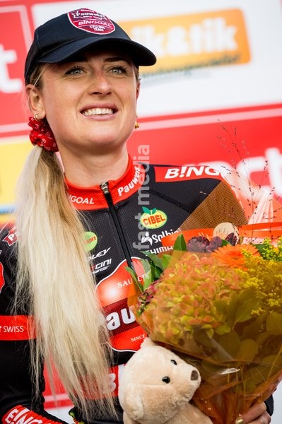 Dutch Denise Betsema celebrates on the podium after the women's elite race of the 'Berencross Meulebeke' cyclocross cycling event, race 3/8 in the 'Exact Cross' competition, Saturday 01 October 2022 in Meulebeke