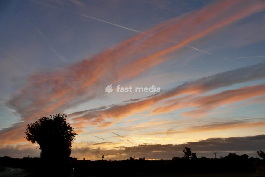 Pretty skies at daybreak as the sun rises over the countryside